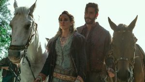 Matilda Anna Ingrid Lutz como Michelina e Lorenzo De Moor como Muto em Na Rota do Ouro (Divulgação / Netflix)